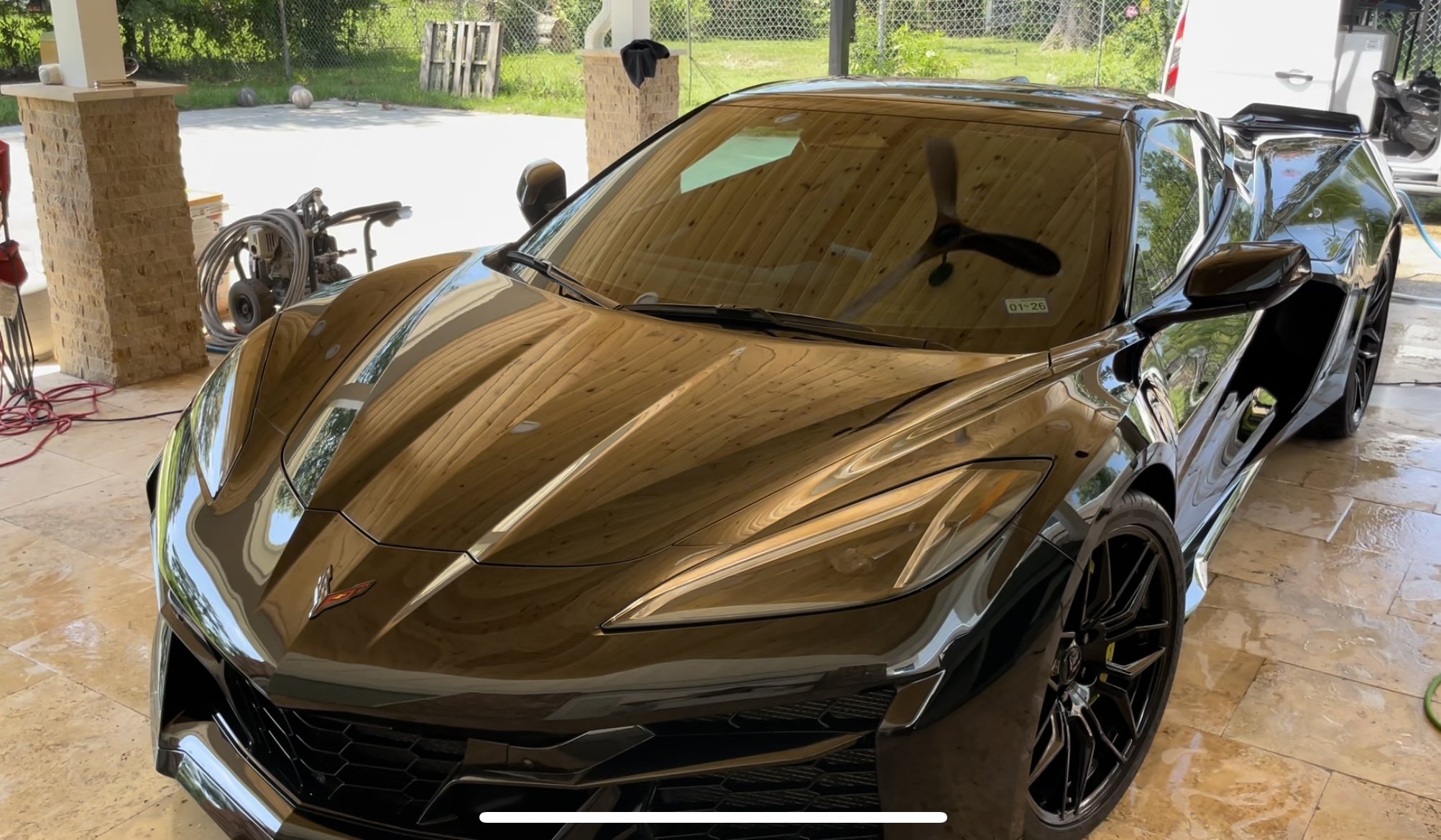 Black Corvette Z06 with a mirror-finish showroom shine after detailing